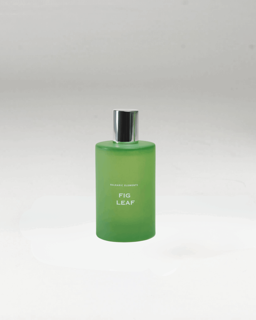 Fig Leaf Home Spray 100ml in a frosted green glass bottle with botanical illustration box, inspired by the elements of the Balearic earth, limited edition by Balearic Elements".
